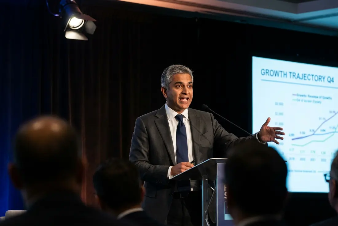 Generated image of Raj Patel presenting at a conference